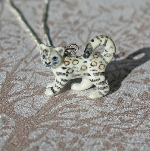 Baby schneeleopard porzellan - baby,