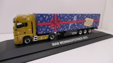 Herpa 1:87 - MAN TGX GX Koffer-SZ "Weihnachtstruck 2023" - PC-Modell 955522