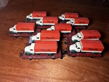 Konvolut von 10 kurzen MÄRKLIN Niederbordwagen mit Märklin-LKWs