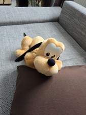 Plüschtier Pluto liegend