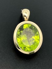 ANHÄNGER AUS 375/- GELBGOLD MIT PERIDOT FACETTENREICH SCHMUCKJAGD