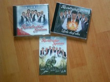 2 CD's von den KASTELRUTHER SPATZEN, ( 2002 und 2005 ) und neue Autogrammkarte