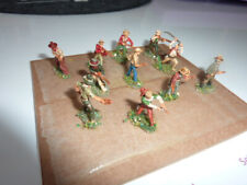 Cowboys reitend & zu Fuß 