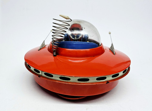 Flying saucer with space pilot - flying,