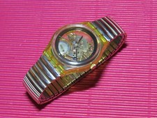 REFURBISHED / neuwertige Swatch GOLDEN JELLY mit goldfarbenem Flexarmband
