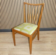 1 v.2 formschöner 50er Jahre Esszimmerstuhl Federkern Sitz Sprossenlehne vintage