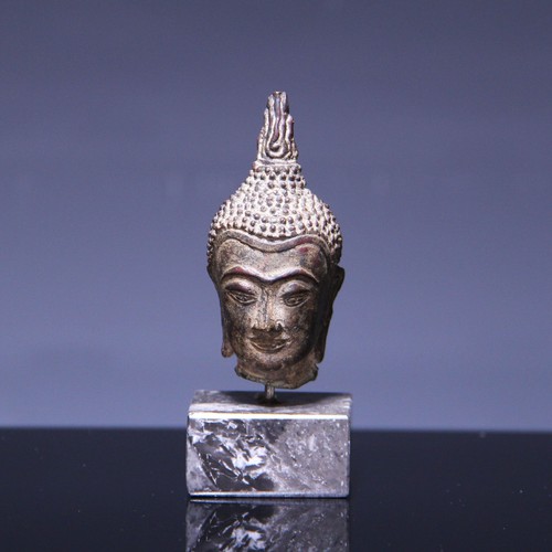 Small bronze head - of,