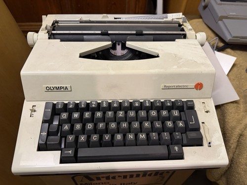 Olympia report electric - report,