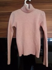 Rosa Rollkragenpullover Strick