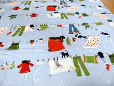 Katzen auf der Wäscheleine