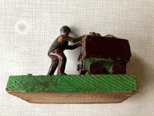 Bergmann mit Lore bei der