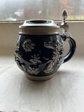 Bierkrug mit Zinndeckel mit