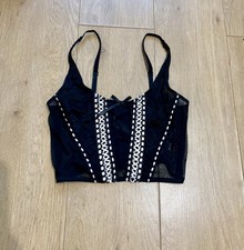 Schwarzes weißes Korsett-Top