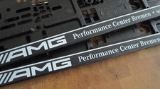 2x KFZ-Kennzeichenhalter original Mercedes-Benz 'AMG Performance Center Bremen'