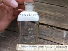"Mastixlösung" Apothekerflasche mit Glasstopfen, Beschriftung in Email Sanitäter