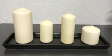 Tablett mit vier Kerzen