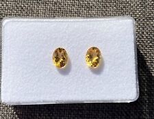 Edelsteine, Schmucksteine: ein Paar ovale, facettierte Citrine in guter Qualität