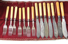 antikes Besteckset mit Beingriffen in Tuchrolle 14tlg