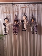 4 Clowns auf Schaukel mit