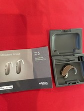   Oticon Xceed  3 SP behind