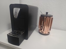Cremesso Kapselmaschine – Schwarz + Kapselhalter (Kupfer)