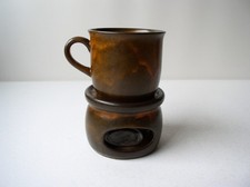 Tasse mit Stövchen für Tee