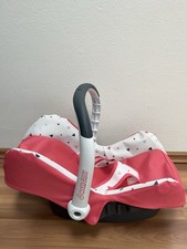 Puppentrage „Maxi-Cosi“ in pink mit verstellbarem Tragegriff