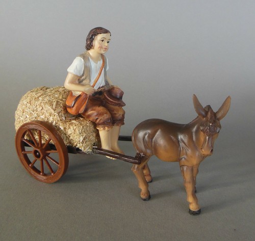 Esel mit hirte auf strohwagen - esel,