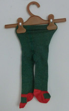 Grüne Strumpfhose mit roten