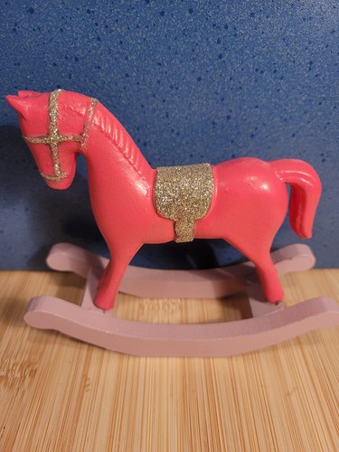 Schaukelpferd pink gold