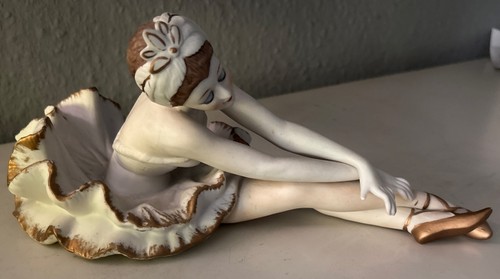 Porzellanfigur sitzende