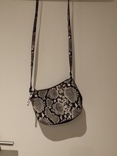 Kleine Schlangenmustertasche