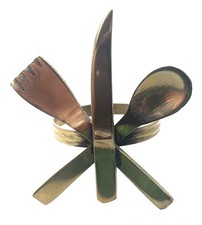 Vier Serviettenringe Messing