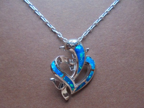Manmade opal delfin in - ,