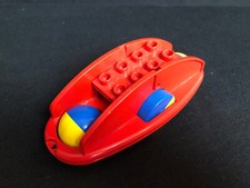 Lego Duplo x1316c01 Rassel-Schaukelboden mit rot/blauen Rädern von 1980