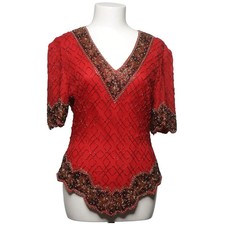 Laurence Kazar, Top, Größe