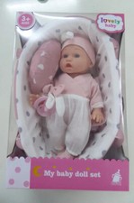 Puppe und Puppentrage.