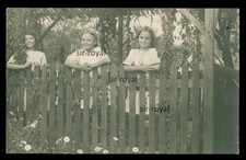 Girl posing at garden fence