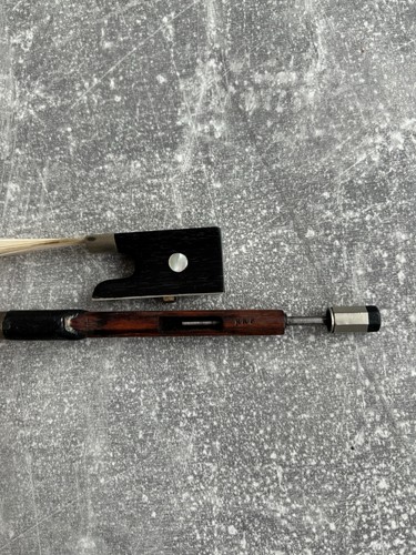 Old violin bow stamped