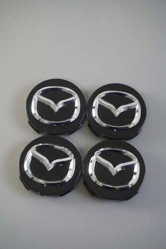 56mm mazda radkappen - 4x,