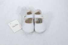 Weiße zeremonielle Lederbabys