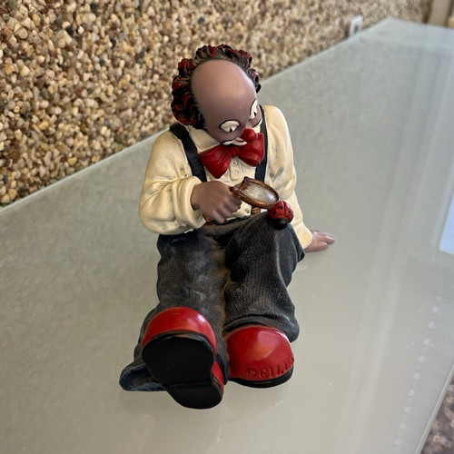 Gilde clown figur sitzend mit - sitzend,