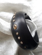 Ebenholz Armreif mit 750 Gold Fassungen und Diamanten