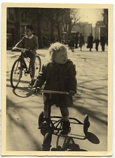 Little girl on bike tricycle