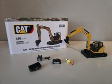 Diecast Masters Cat 309 Bagger mit Anbaugeräten 1:50 (85592) in OVP