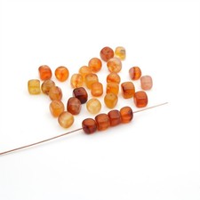 29 small carnelian cube beads