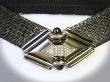 altsilberfarbener Stretchgürtel mit Metallschuppen und großer  Schließe