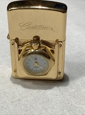 Sturm-Feuerzeug Cadillac, goldfarbe, mit Uhr ( Batterie leer ),ohne Feuerstein