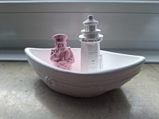 Drei figuren bot leuchturm - figuren,