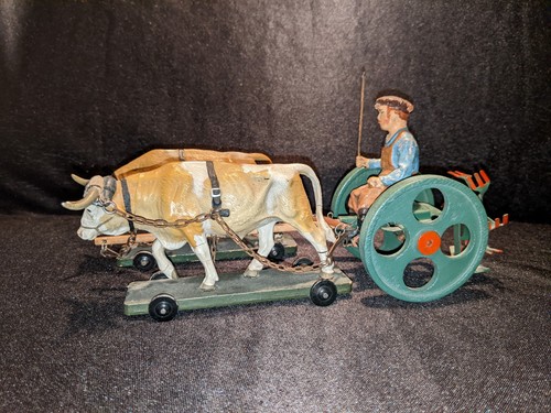 Kartoffelroder mit zugochsen - kartoffelroder,
